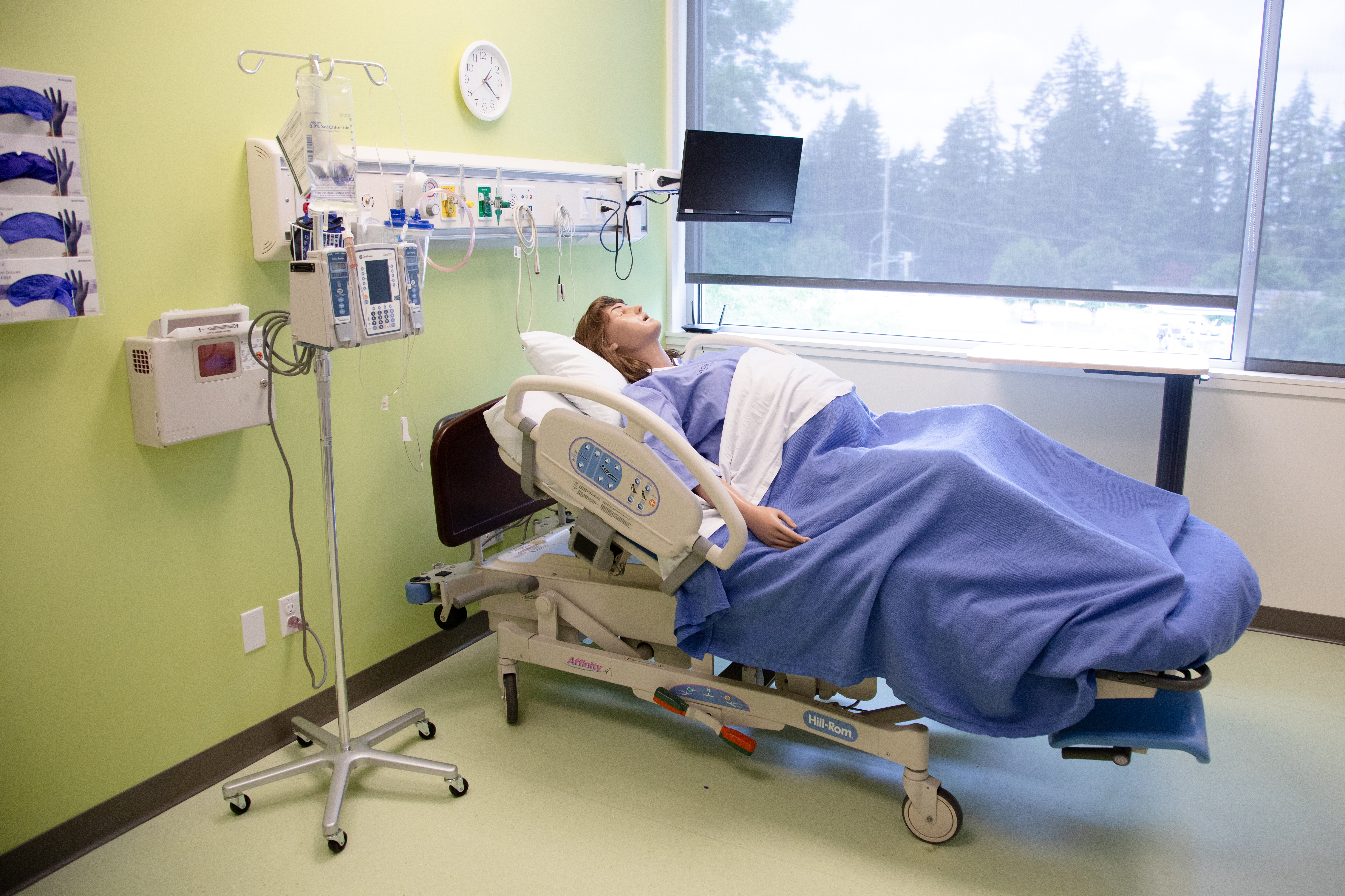 Photo of simulation patient in hospital bed