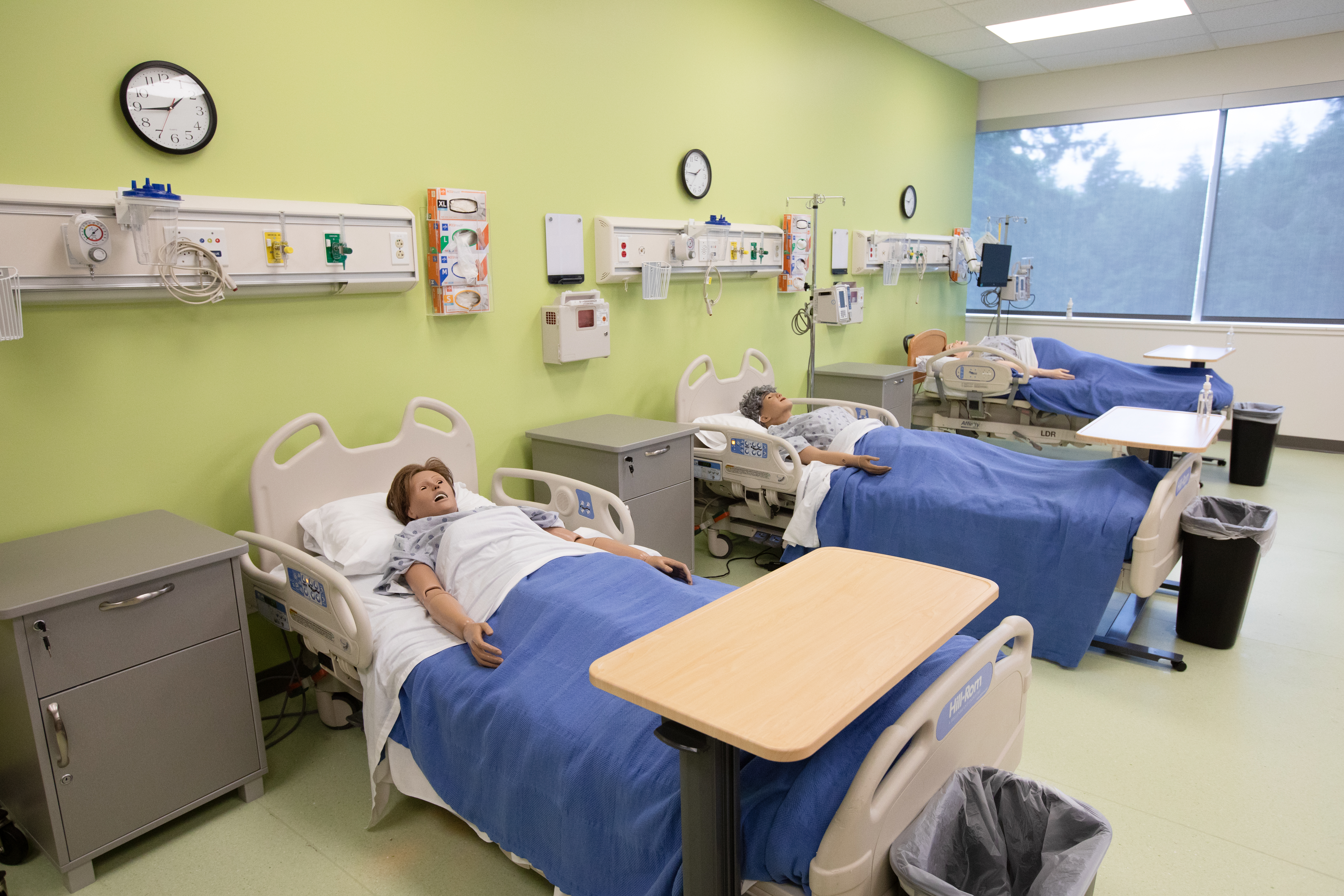 Photo of simulation patients in hospital beds