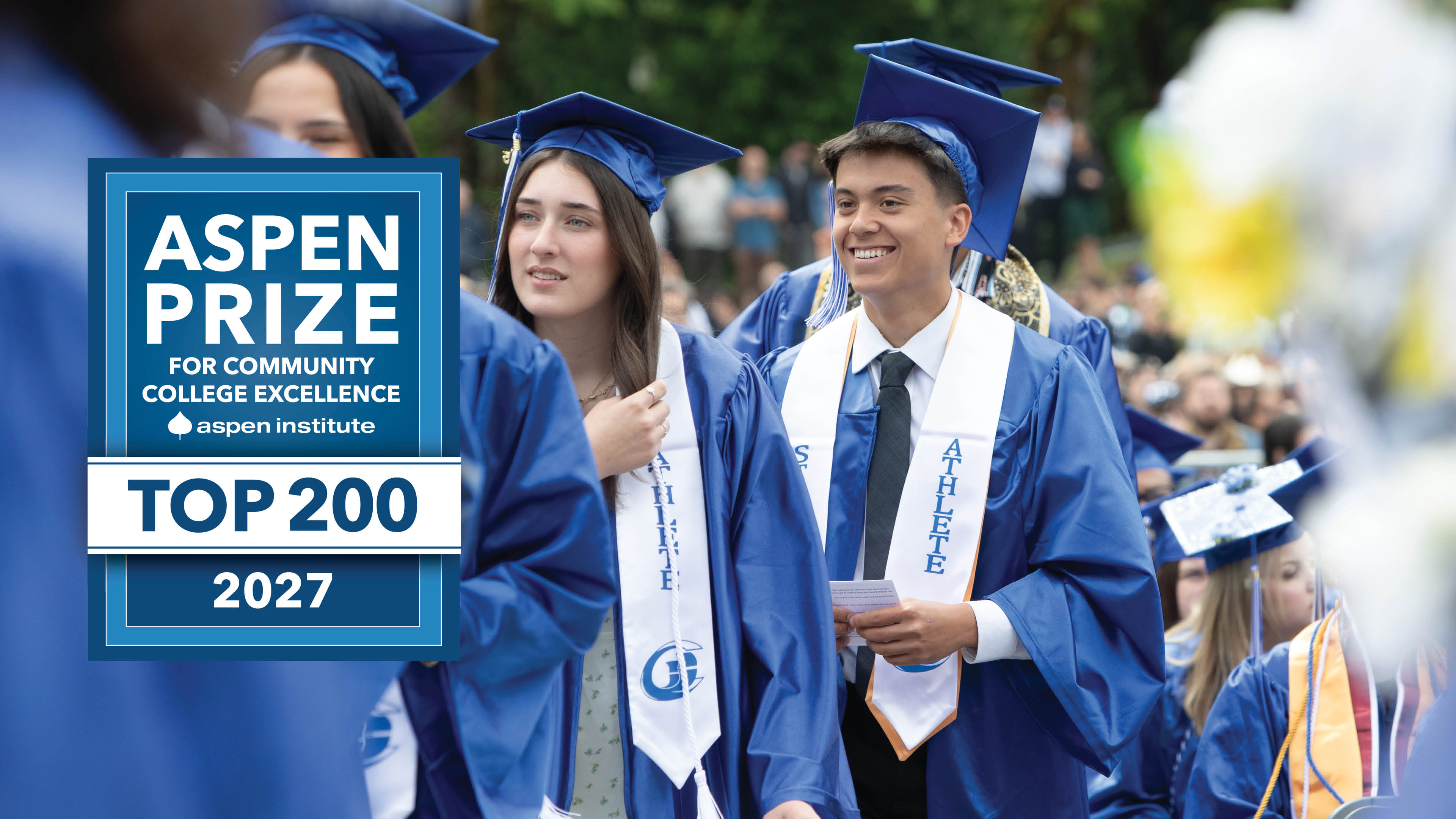 An Aspen Prize for Community College Excellence Top 200 2027 badge on a photo of SPSCC students graduating wearing caps and gowns