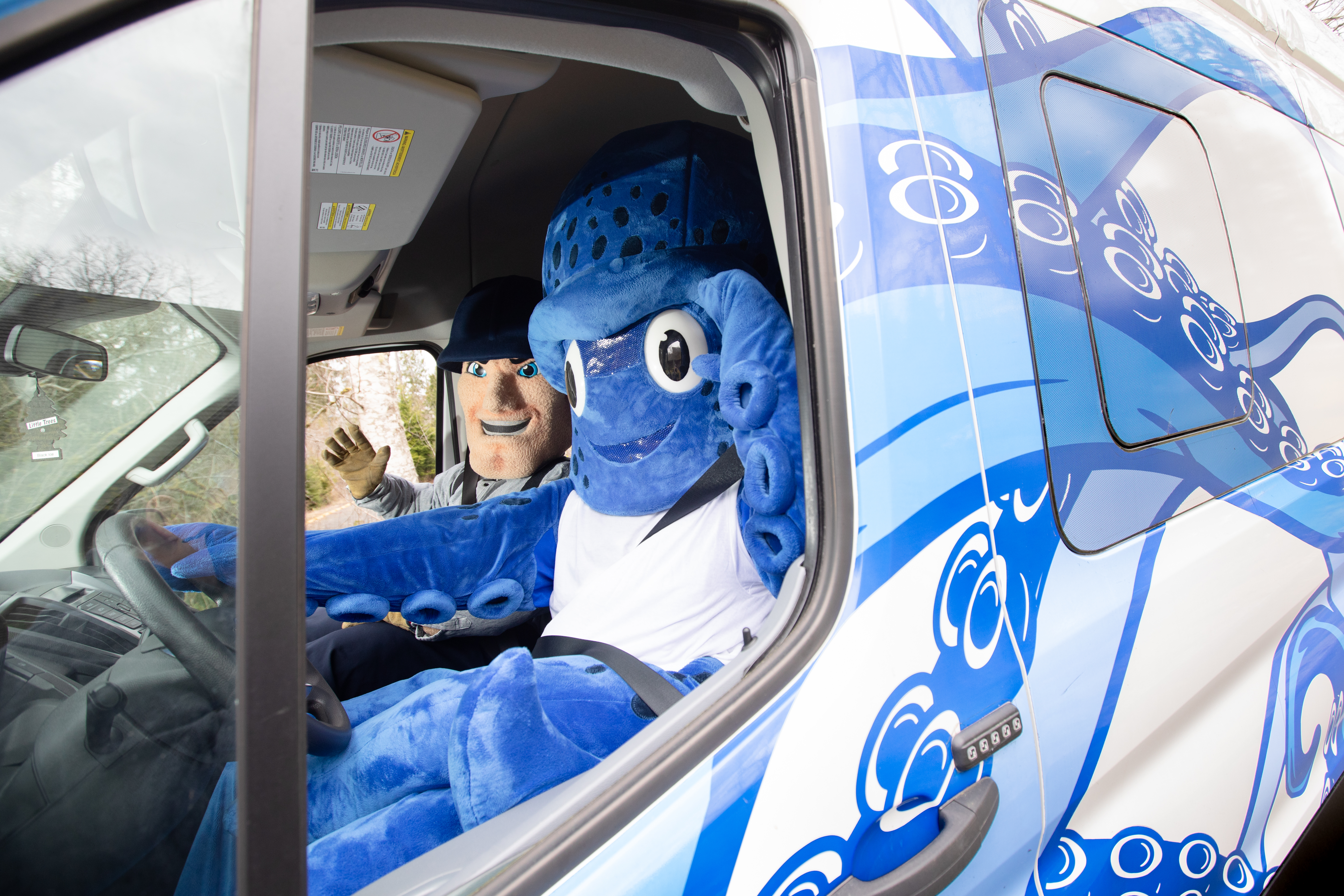 Percy the Kraken driving the Kraken Van with Charlie Choker in the passenger seat