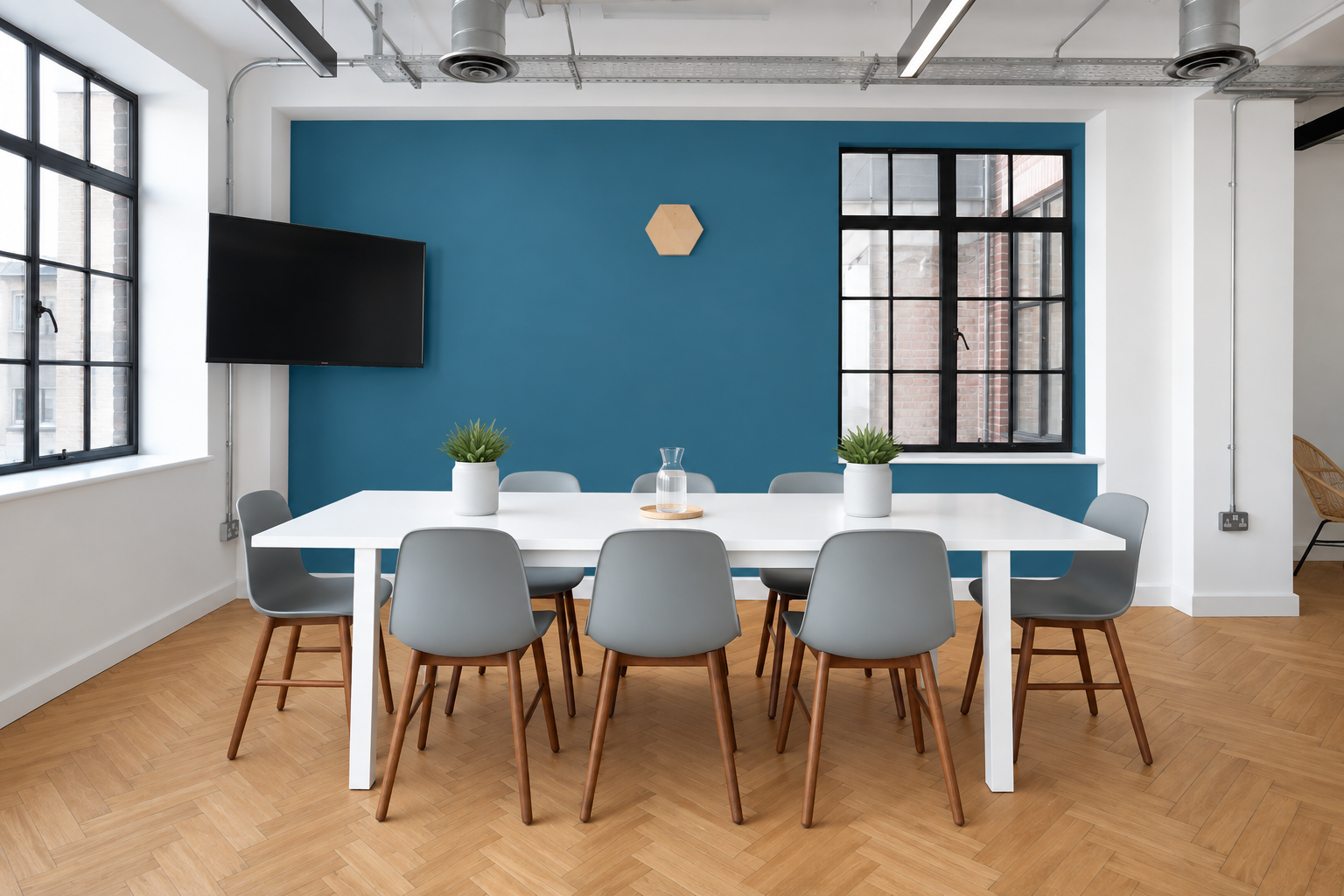 An office with the back wall painted blue