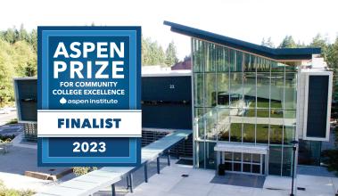 Photo of Building 22 with a badge that reads "Aspen Prize Finalist 2023"