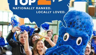 Kraken mascot with a crowd and a graphic that states "Top 2"