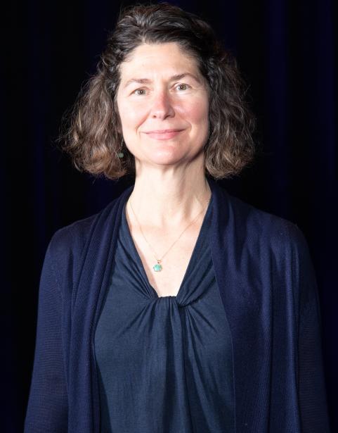 English professor Kathleen Byrd in front of a black background