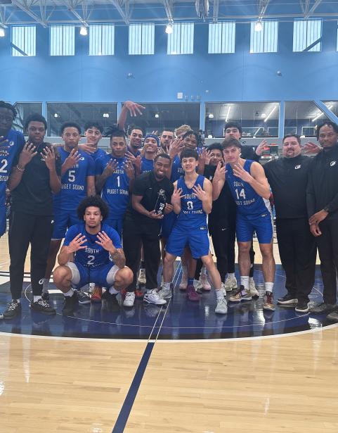 The Clipper Men's Basketball team celebrates their win over the Portland Panthers that secures their place in the Final Four of the NWAC Championships.