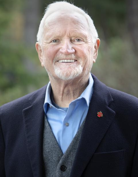 SPSCC Trustee Mark O. Brown in front of greenery