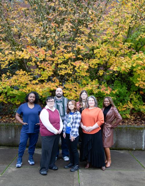 A group of SPSCC students in front of fall foliage