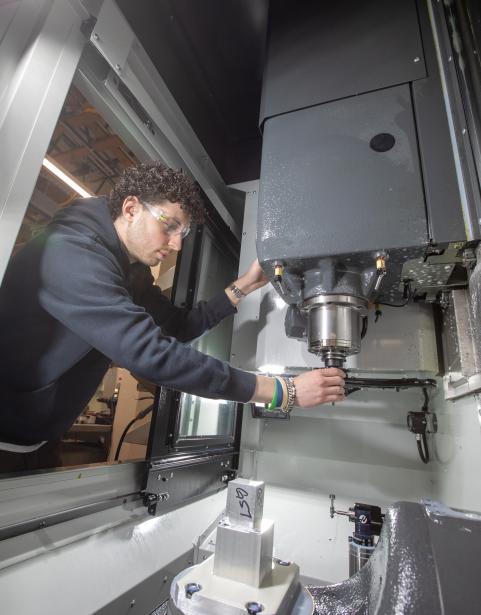 An SPSCC Machining Technologies student operating a machine