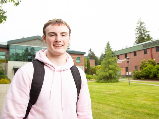 Student Arne Wiseman standing outside in SPSCC's Quad