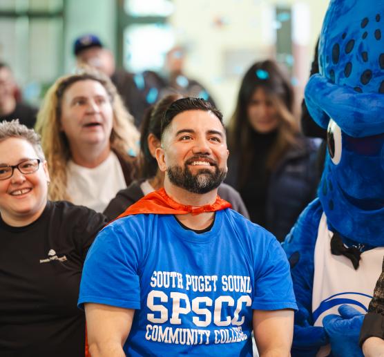 employee smiles in a crowd