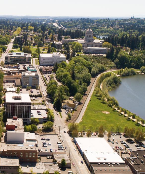 aerial photo of downtown Olympia with buildling, lake, and capitol building