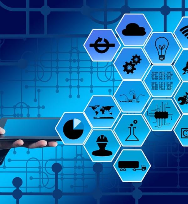 A person dressed in a suit holding a tablet with icons for different apps displayed