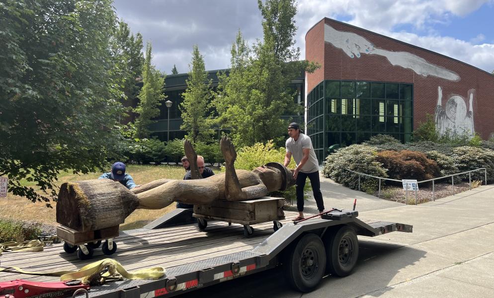 The SPSCC Welcome Figure being taken to Andrea Wilbur-Sigo's (Squaxin Island and Skokomish) workshop to be restored