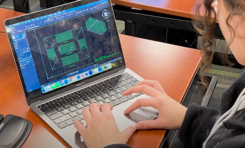 aec software on laptop screen with student hands on laptop