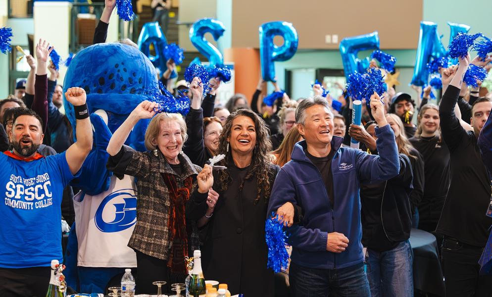 SPSCC staff, faculty, and community members cheering at the Aspen Watch Party